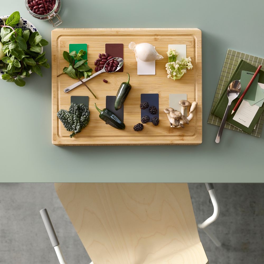 Functional table setup with MITTZON folding table, LÄKTARE chair and APTITLIG chopping board.