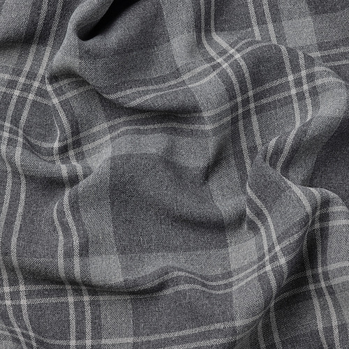 Primer plano de las cortinas de tartán gris oscuro de HÄGGVECKMAL, con tejido fino y tejido texturizado.