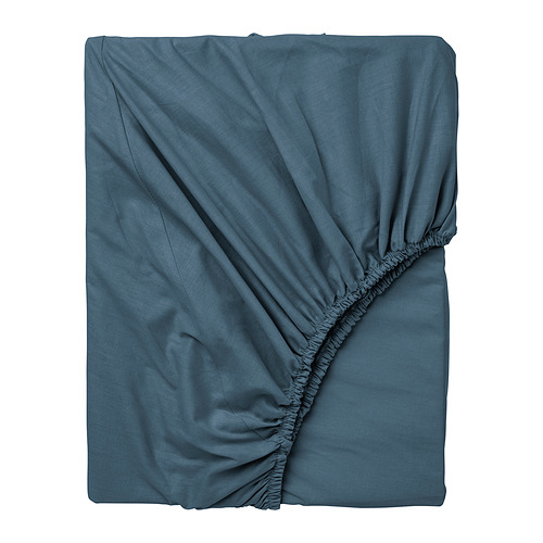 Es una sábana de algodón DVALA azul, rectangular, doblada con bordes ondulados.