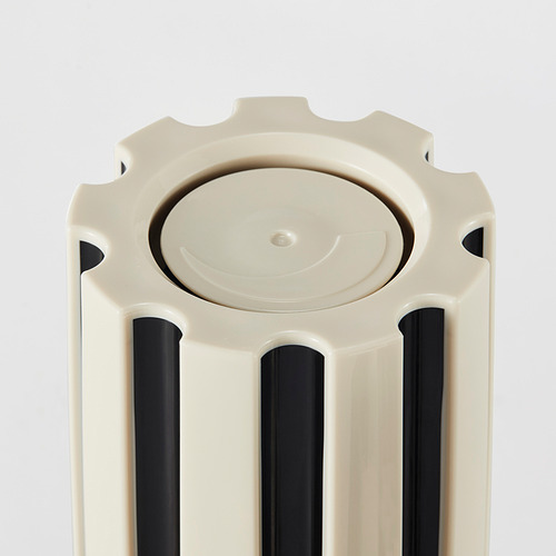 Molinillo de especias con tapa circular y rayas verticales. Diseño duradero y moderno.