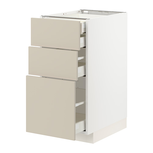 Un mueble de cocina METOD blanco con cajones beige de diseño minimalista.