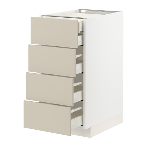 Un mueble de cocina METOD blanco con cajones beige. Tiene varios cajones con un diseño suave y minimalista.