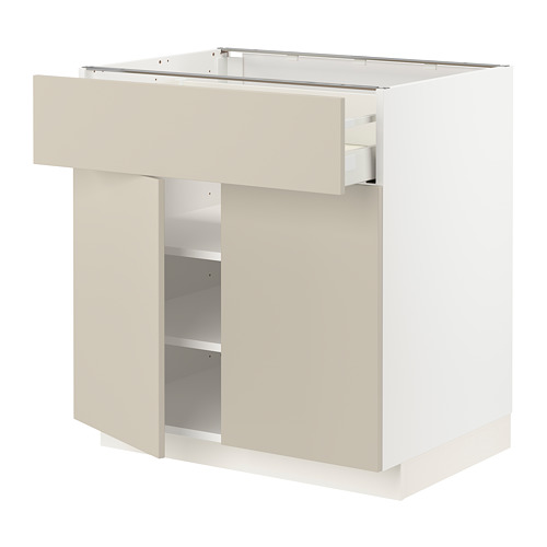 Mueble de cocina METOD blanco con cajón y estantes beige.