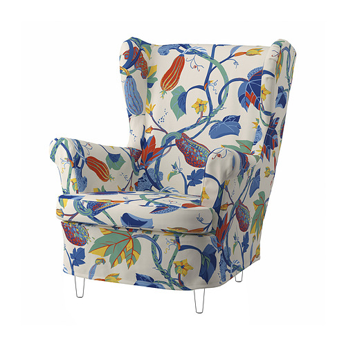 Sillón blanco floreado, respaldo alto, estampado de hojas coloridas, patas de madera.