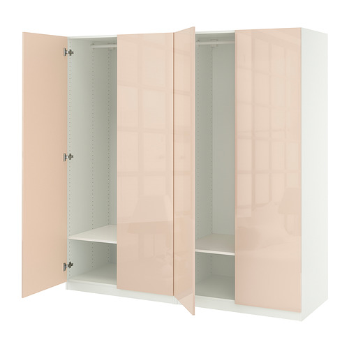 Un armario abierto PAX de ikea color melocotón con estantes ajustables.