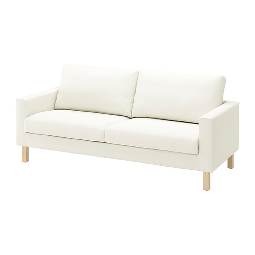 Un sofá blanco de SALTSJÖBADEN con un aspecto ligero y luminoso. Su estructura está hecha de madera maciza, ofreciendo un diseño cómodo y moderno.