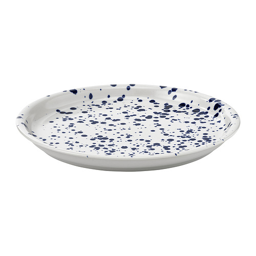 Un plato de cerámica blanca con diseño moteado azul, forma redonda y bordes ligeramente elevados. Parte de la colección SILVERSIDA.