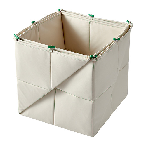 Un contenedor de almacenamiento GREJSIMOJS, de color crema, de forma cuadrada, con material de tela y acentos verdes.