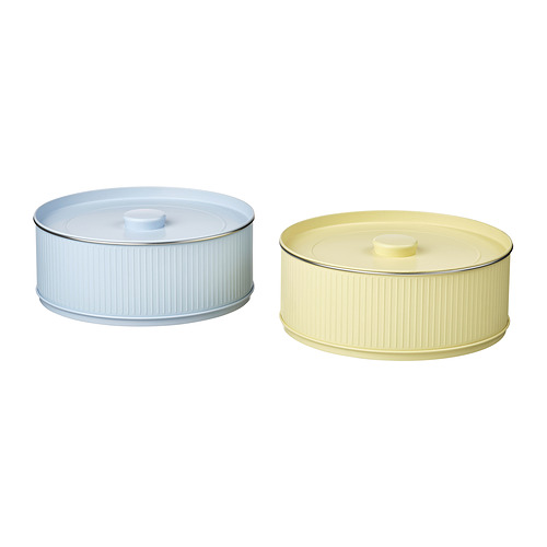Dos latas redondas acanaladas en azul y amarillo con tapas a juego, acero estañado con laca poliéster.