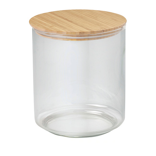 Tarro de vidrio transparente con tapa de bambú, forma cilíndrica.