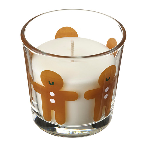 Vela blanca en frasco de vidrio transparente con calcomanías de hombre de jengibre, diseño festivo y festivo.