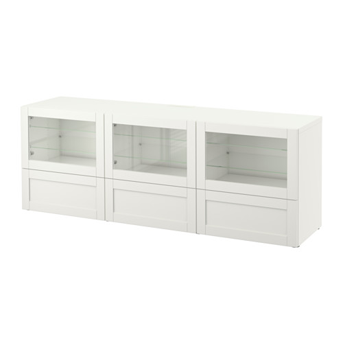 Mueble de tv blanco BESTÅ con puertas y cajones de cristal. Diseño moderno para el almacenamiento de equipos multimedia.