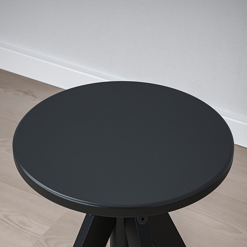 Taburete redondo negro regulable en altura, ideal para cualquier ambiente.