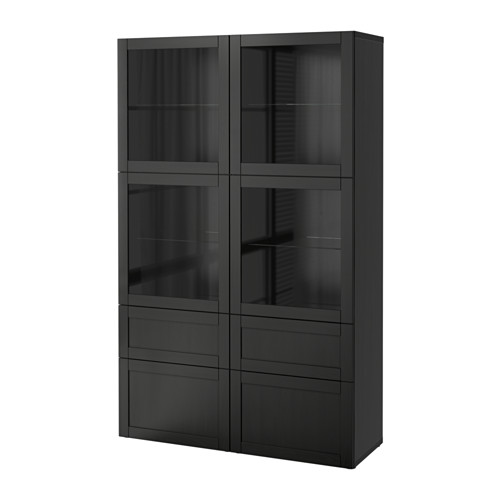 Un armario BESTÅ negro de ikea con puertas y cajones de cristal, que ofrece almacenamiento sin polvo con un diseño elegante.