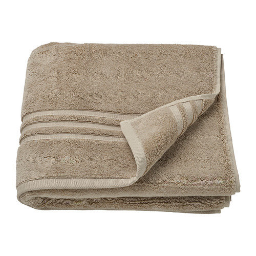 Toalla BROKGLIM, beige, algodón orgánico, doblada con un borde decorativo.