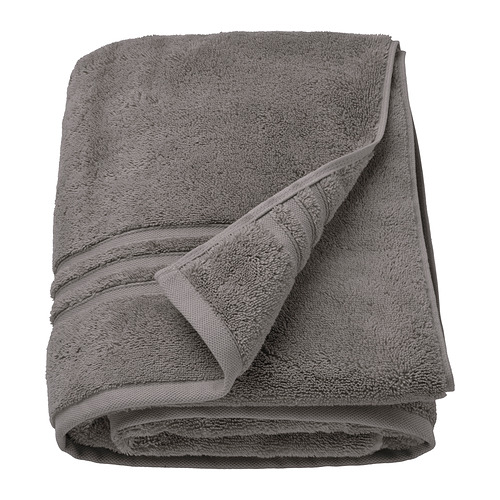 Toalla de algodón orgánico BROKGLIM gris, doblada, suave con borde tejido.