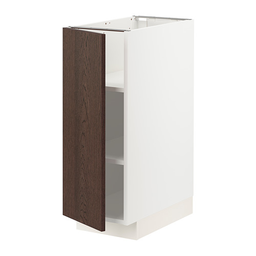 Un mueble de cocina moderno, llamado METOD, con marco blanco y puerta de madera marrón oscuro, con un diseño elegante y una construcción robusta.