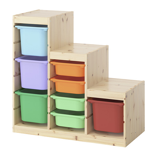 Almacenamiento Ikea TROFAST con cubos multicolor para juguetes de niños, marco de madera clara.