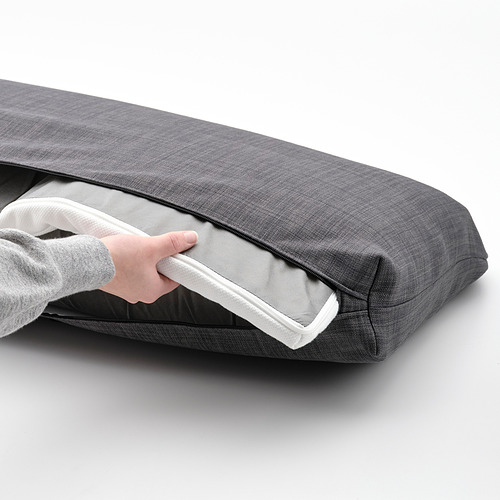 Cojín de sofá cama gris con apertura de persona.