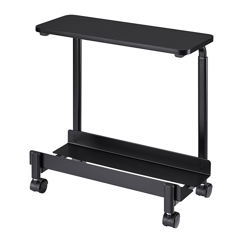 Carro de ordenador rodante negro, ajustable en anchura y altura, con estante superior para almacenamiento.