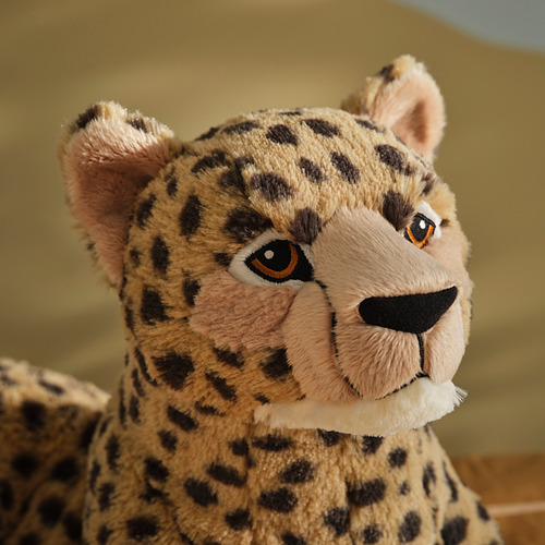 Juguete de guepardo de peluche con detalles suaves y realistas.