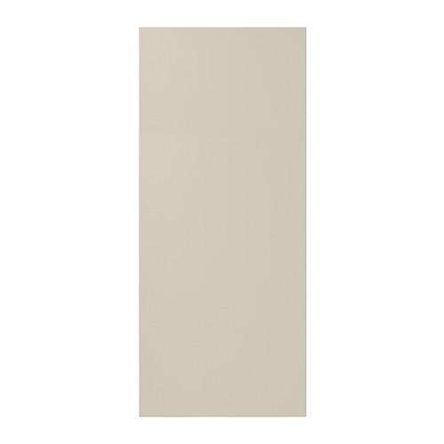 Una puerta de armario HAVSTORP beige con líneas limpias. Es rectangular y está hecho de pintura acrílica y tablero de fibra.