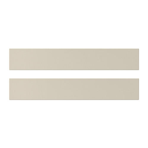 La imagen muestra dos frentes de armarios de cocina HAVSTORP lisos de color beige. Forma rectangular con líneas limpias.