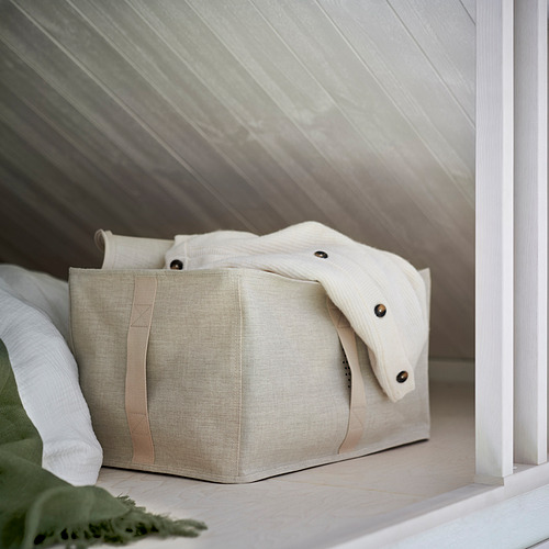 Caja de almacenamiento de tela beige con asas, parte de la serie PURRPINGLA, organiza la ropa y la ropa de cama, se adapta a armarios pax, con ventilación.