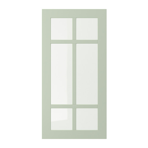 Puerta de cristal verde STENSUND. Diseño rectangular de cuatro hojas, tablero de fibra lacado con vidrio transparente.