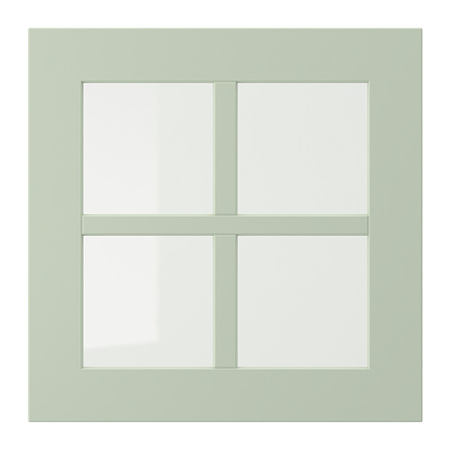 Una ventana de cuatro paneles, de forma cuadrada, de color verde claro con marco de madera.