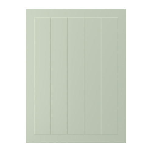 Una puerta de armario STENSUND verde con ranuras verticales. Su forma rectangular está hecha de tableros de fibra, suave al tacto.