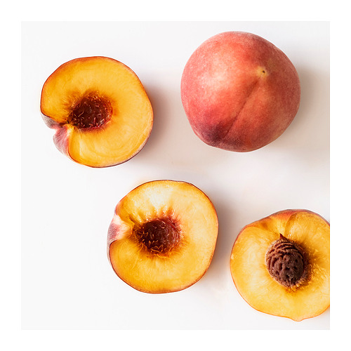 Vela de melocotón amarillo KRONSÅNGARE en vidrio, color natural, mecha de algodón, diseño redondo