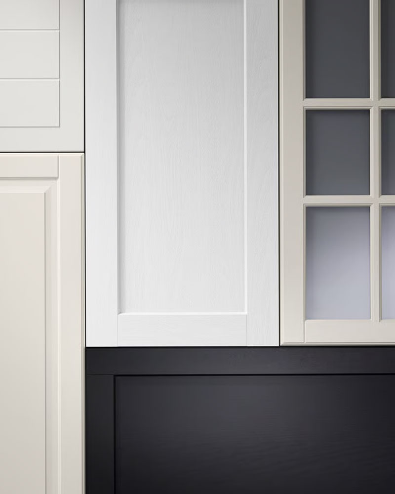 Kitchen fronts with traditional expressions in dierent colours are placed in a graphic pattern against a grey background.
