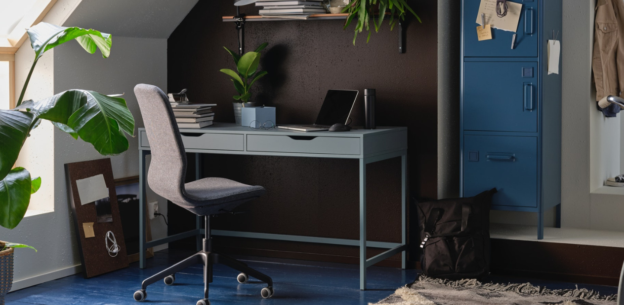 Home office with desk, comfortable chair and storage space