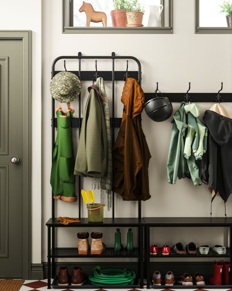 Close-up of the coat rack with clothes and shoes—everything neatly arranged for quick, practical outings.