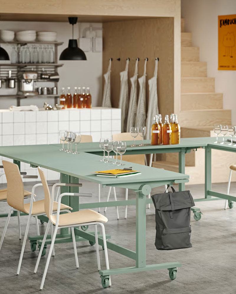 Several green MITTZON foldable tables arranged in a U-shape, paired with LÄKTARE conference chairs
