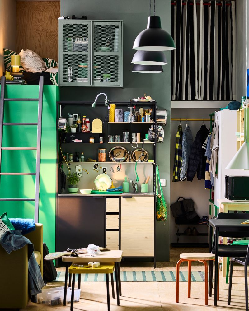 Freestanding ÄSPINGE kitchenette in black/ ash in green student accommodation.