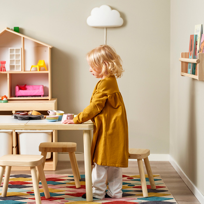 a girl playing at her children's table
