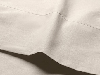 beige bed sheet