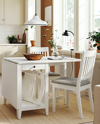 white folding dining table with folding chairs