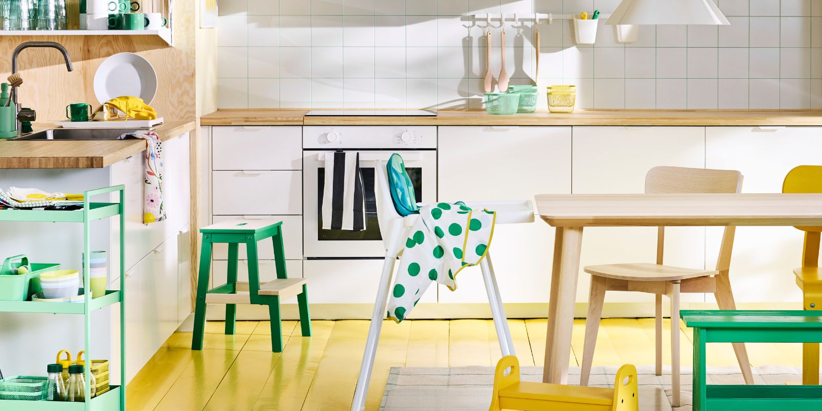 Scandinavian modern kitchen with white  ANTILOP highchair, NISSAFORS trolley and  LISABO table and chair