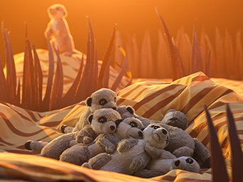 A group of SANDLÖPARE soft toy meerkats are sleeping in a pile on a sunlit savannah made from cardboard cutouts and bedding.