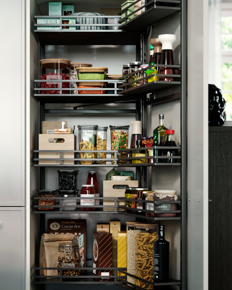 A pantry with UTRUSTA pull-out larder, filled with jars, bottles, pasta, sauces, and wooden boxes on the shelves.
