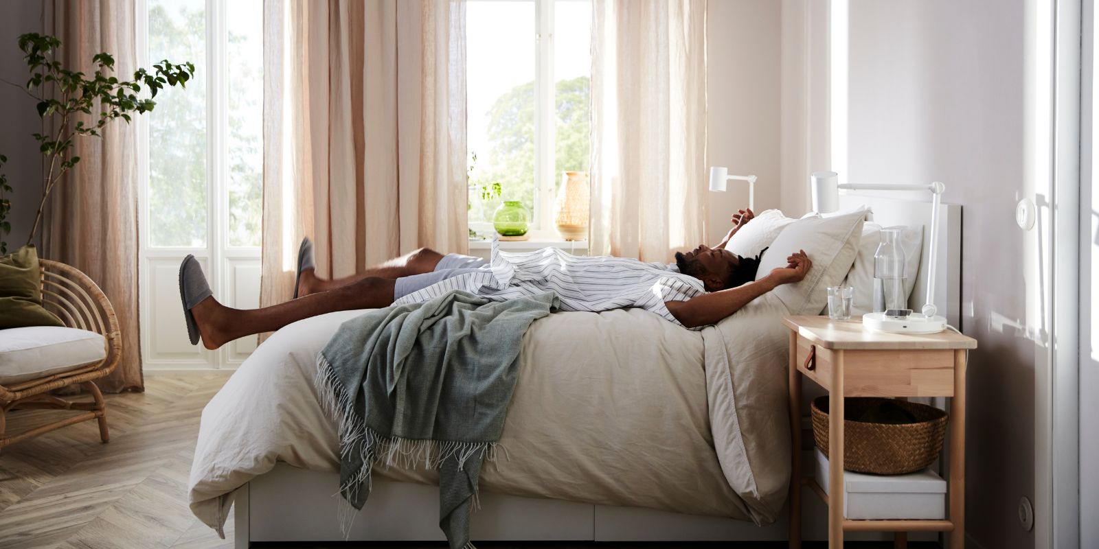 Translucent curtain, pair on the bed