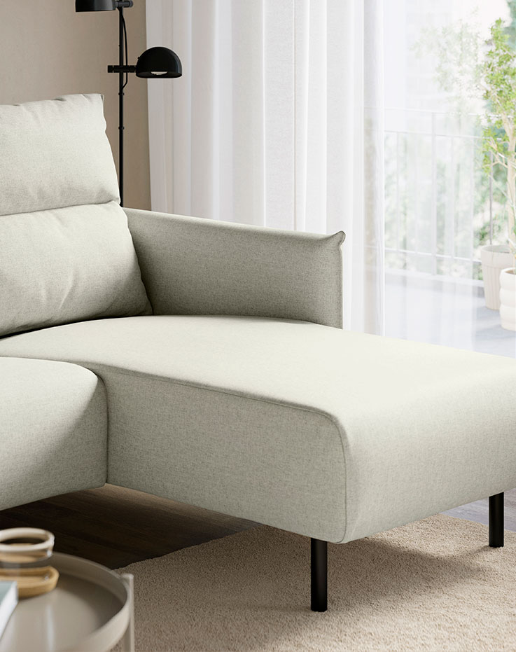 Sectional, 4-seat with chaise, Gunnared beige in the corner of the room.