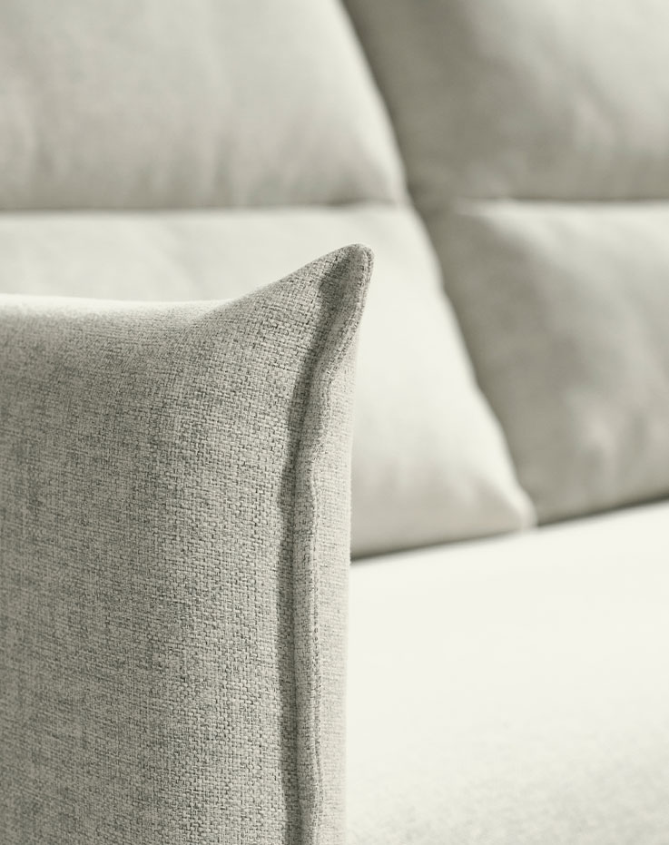 Light-colored furniture armrests.