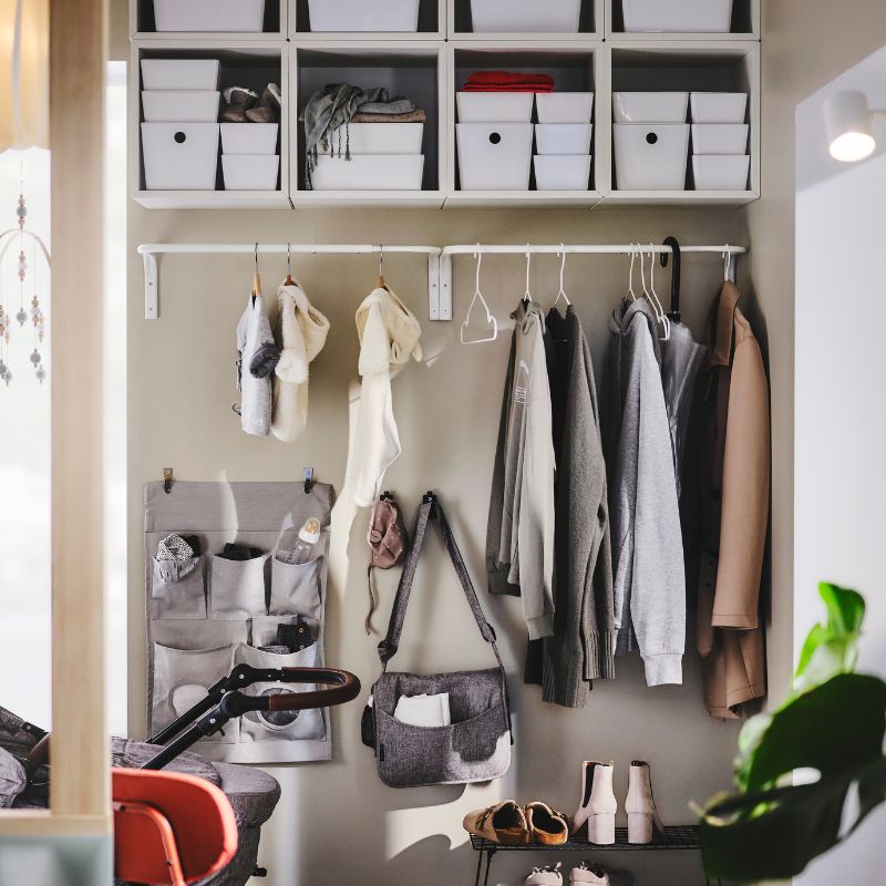 Sleek storage wall that opens up space and keeps shoes and outdoor gear tidy.