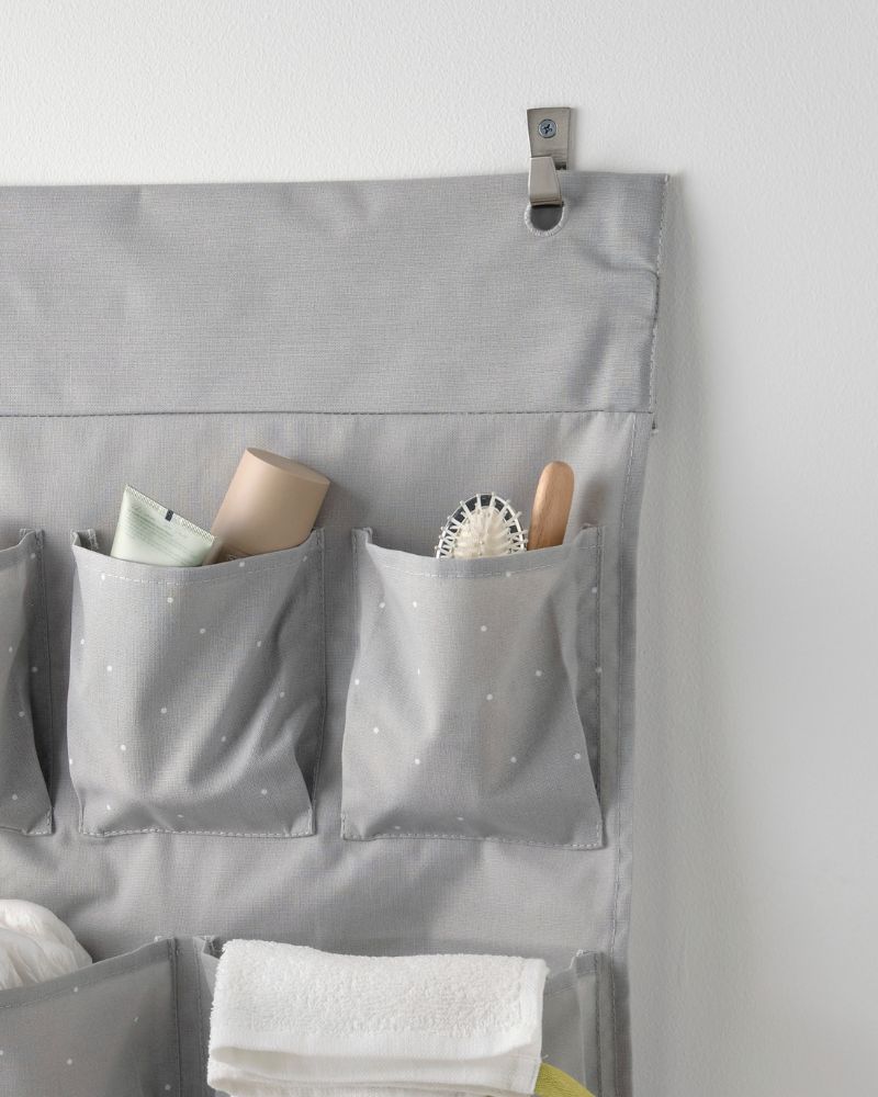 Functional hanging storage with the LEN organizer, featuring pocketed sections and KRAMA cloths, supported by BLECKA hooks.