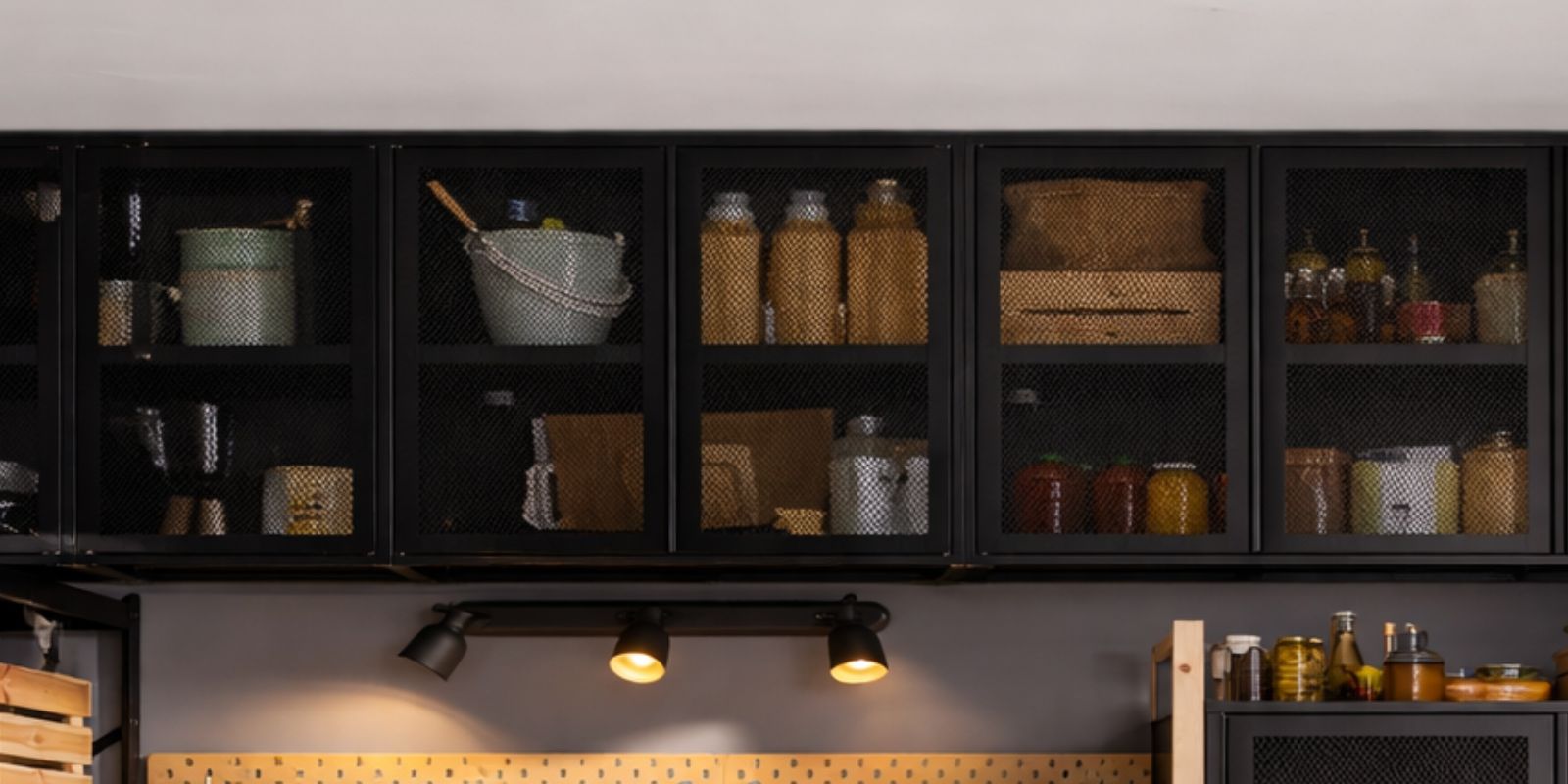 Green metal cabinets with partially closed doors; canned goods are visible inside, neatly arranged on the shelves.