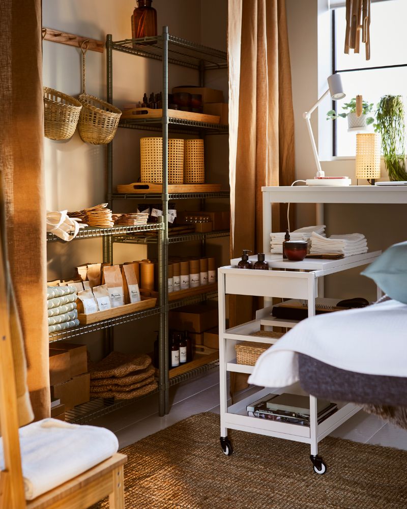 Warm space featuring ANNAKAJSA curtains, OMAR shelving and TOLKNING baskets for natural organization.